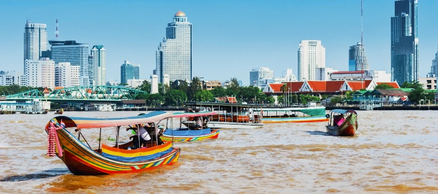 Lomgtail boats on bangkok's River ona vegan thailand tour