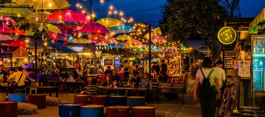 Chiang Mai Night Bazaar - vibrant evening market with colorful stalls and shoppers