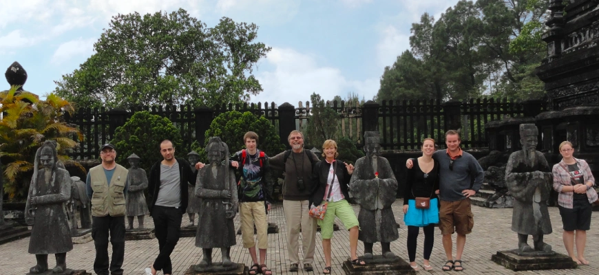 A GoVegan Travel group posing for photos outside the Forbidden City in Hue, Vietnam