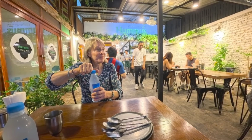 Customer dining inside Hummus Chiang Mai, a vegan friendly restaurant in Chiang Mai